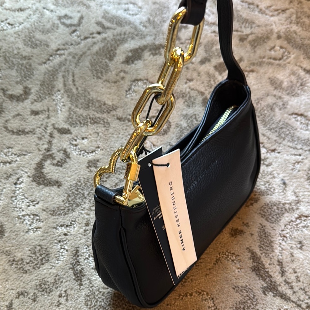 Aimee Kestenberg Black and Gold Shoulder Bag with Structured Design